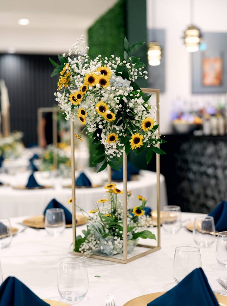 Flowers by Dream Bouquet Brandon and Briana reception flowers at The Waters Edge